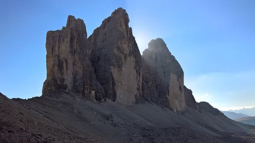 Low angle view of rock formations against sky