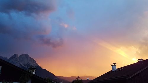 Low angle view of silhouette buildings against sky during sunset