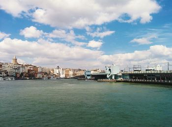 View of bridge over river against cloudy sky