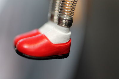 Close-up of red object over white background