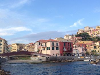 River by city against blue sky