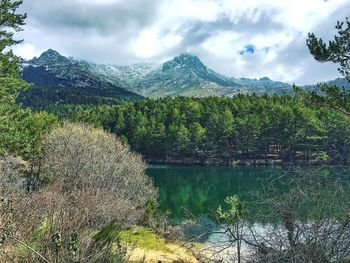 Scenic view of lake against cloudy sky