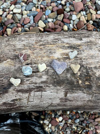 High angle view of pebbles on wood