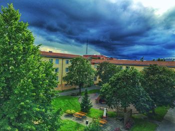 Buildings against cloudy sky