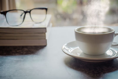 Close-up of coffee cup on table