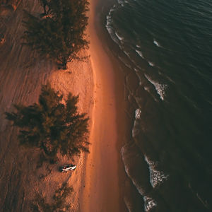 Drone shot of otres beach from high angle during sunset in sihanoukville, cambodia.