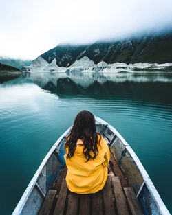 Rear view of woman looking at lake