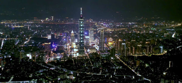 High angle view of illuminated city buildings at night