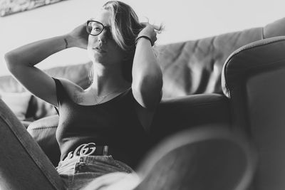 Woman sitting on sofa