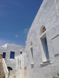 Low angle view of building against blue sky