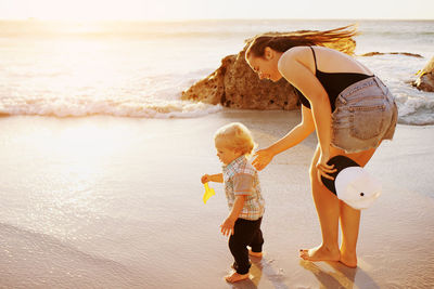 Rear view of women on beach