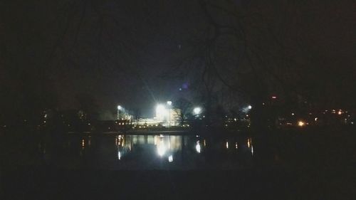 Reflection of illuminated lights in puddle