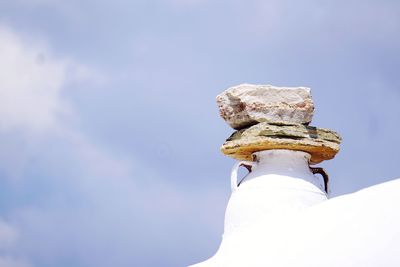 Close-up of chimney against blue sky