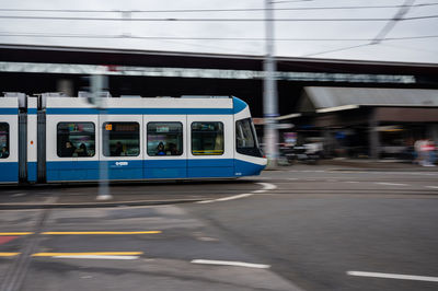 Train on railroad track in city