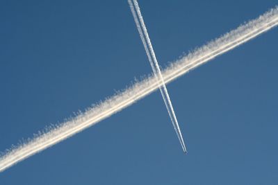 Low angle view of airshow against clear sky