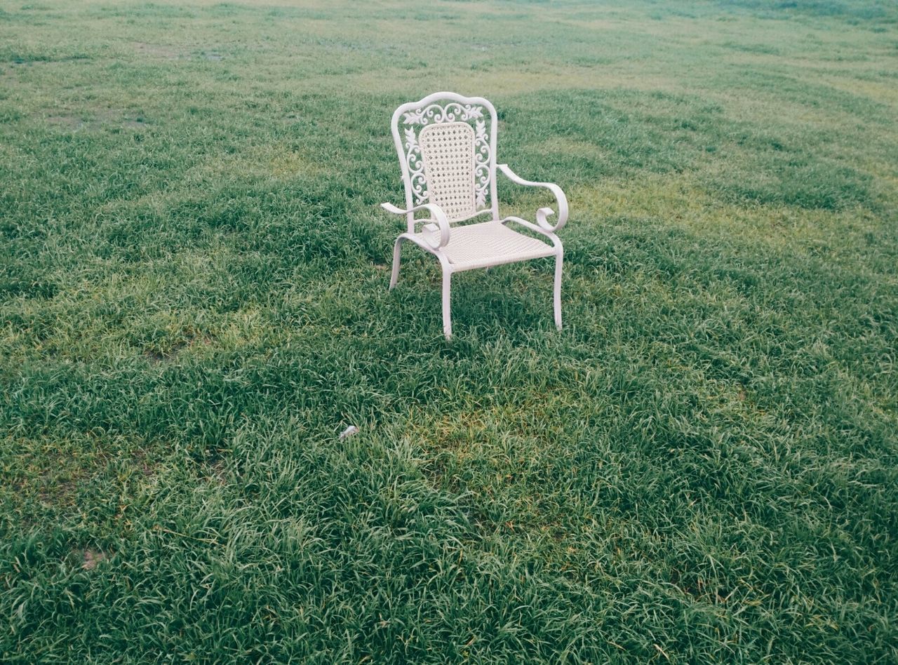 grass, absence, empty, chair, field, grassy, green color, bench, seat, day, tranquility, growth, sunlight, high angle view, outdoors, nature, no people, plant, relaxation, abandoned