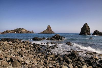 Scenic view of sea against clear blue sky