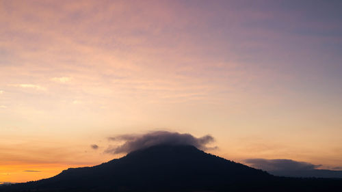 Scenic view of silhouette mountains against sky during sunset