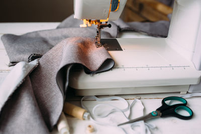 Sewing machine, accessories and fabric. cozy creative sewing process at home