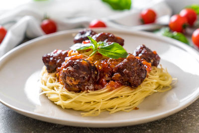 Close-up of pasta served in plate on table