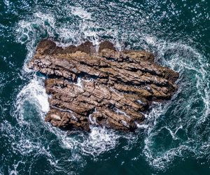 High angle view of rock formation in sea