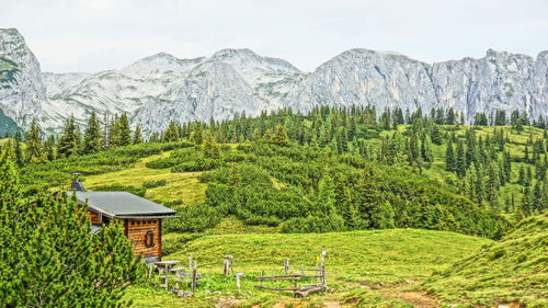 Scenic view of landscape and mountains against sky