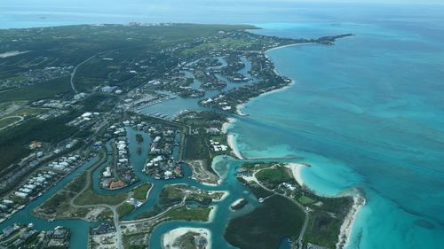 Aerial view of city by sea