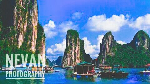 Panoramic view of sea and mountains against sky