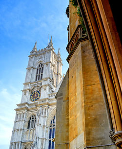 Low angle view of clock tower against sky