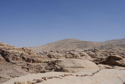 Scenic view of rocky mountains against clear blue sky