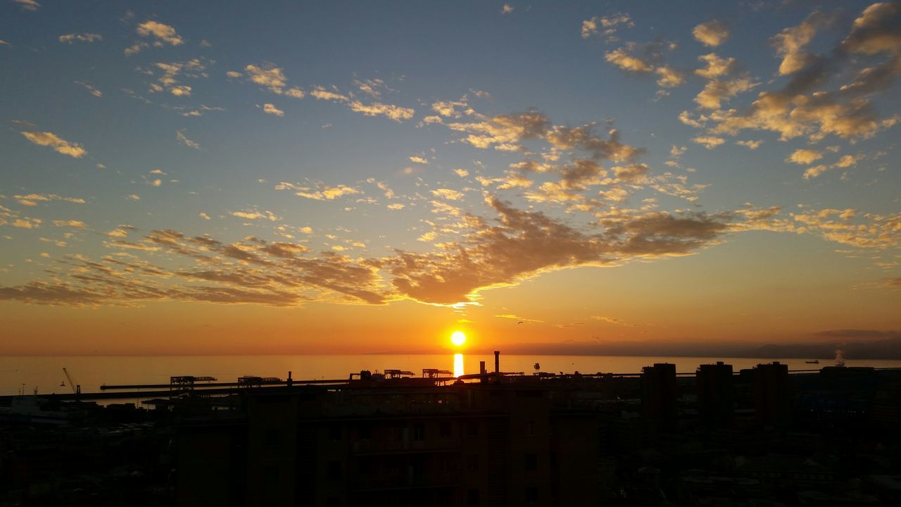 sunset, sea, horizon over water, water, sun, silhouette, sky, scenics, beauty in nature, tranquil scene, orange color, beach, tranquility, idyllic, cloud - sky, nature, shore, sunlight, incidental people, cloud