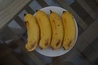 High angle view of fruits in plate on table