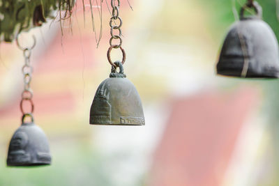 Close-up of metal chain hanging outside temple