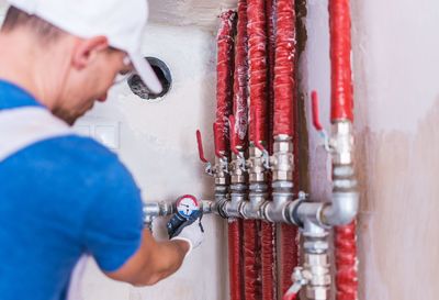 Manual worker checking valve pipes