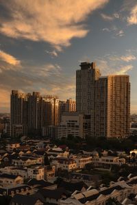 Cityscape against sky during sunset