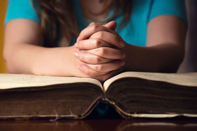 Close-up of hand holding book