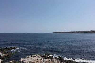 Scenic view of sea against clear sky