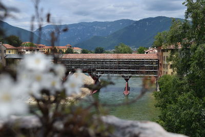 Scenic view of river and mountains against sky