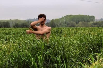 Full length of man standing on field