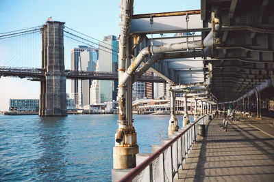 Brooklyn bridge over east river seen from pier