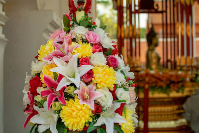 Close-up of flower bouquet against temple