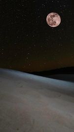 Scenic view of moon against sky at night