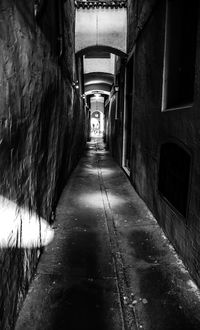 Empty alley amidst buildings