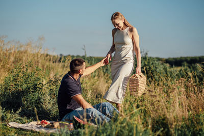 Romantic picnic. young couple in love on summer picnic with watermelon.