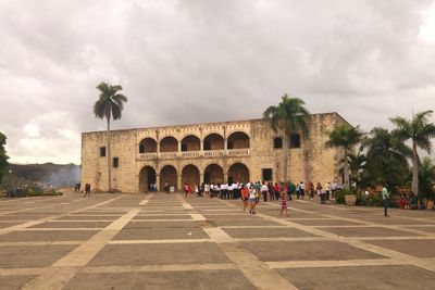 People in front of historical building