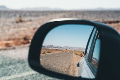 Reflection of car on side-view mirror