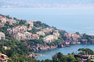 High angle view of townscape by sea