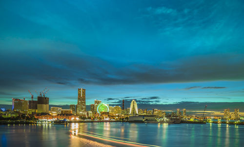 Panorama blue sunset view of the cosmo clock 21 big wheel, landmark tower and pacifico yokohama.