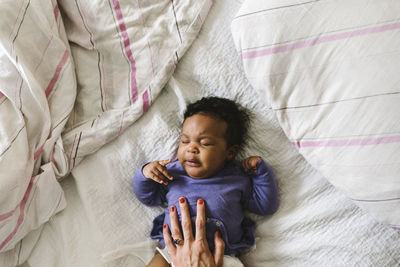 Baby sleeping on bed