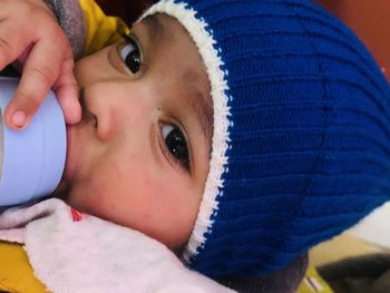 Close-up portrait of baby lying down